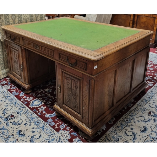 639 - A Superb 19th Century Oak Pedestal Desk with highly carved doors and triple frieze drawers and baize... 