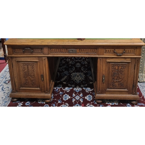 639 - A Superb 19th Century Oak Pedestal Desk with highly carved doors and triple frieze drawers and baize... 