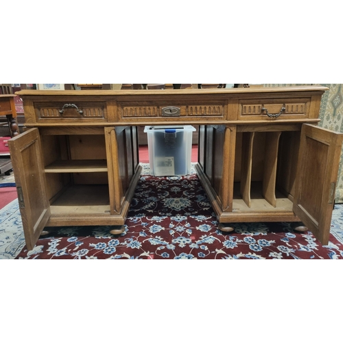 639 - A Superb 19th Century Oak Pedestal Desk with highly carved doors and triple frieze drawers and baize... 