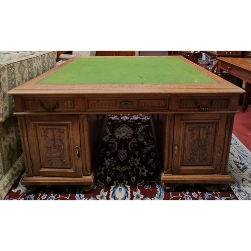 639 - A Superb 19th Century Oak Pedestal Desk with highly carved doors and triple frieze drawers and baize... 