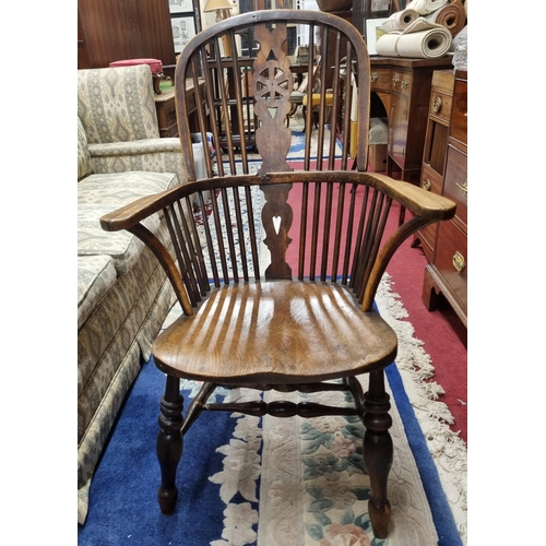 646 - A 19th Century Windsor Armchair. W 167 cm approx.