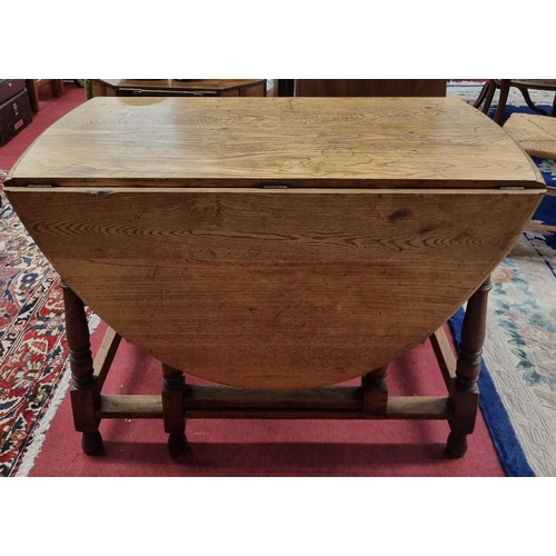 649 - A late 19th Century Oak Gateleg Table of large size. W 107 x 151 x H 74 57 cm approx.