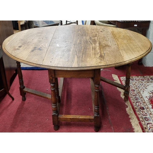 649 - A late 19th Century Oak Gateleg Table of large size. W 107 x 151 x H 74 57 cm approx.