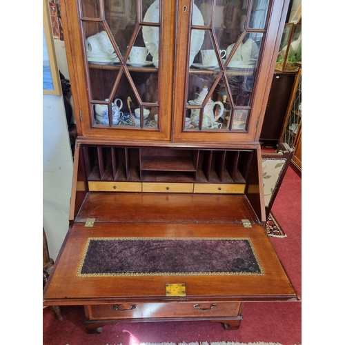 400 - An Edwardian Mahogany and inlaid bureau Bookcase with astragal glazed moulded doors.
W 89 x D 50 x H... 