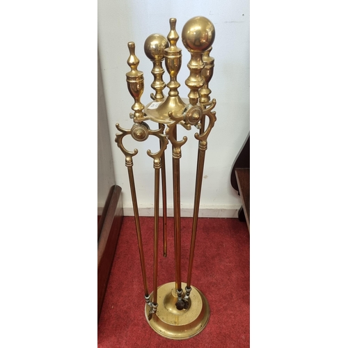 412 - A 19th Century Brass Companion Set on single shaft pedestal. H 80 cm approx.