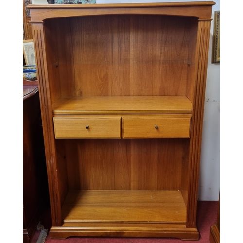 426 - A reproduction Hardwood Bookcase with adjustable shelving and fluted front supports. W 84 x D 33 x H... 