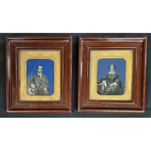 593 - A pair of overpainted Photographs of a Husband and Wife in original hardwood frames with etched slip... 