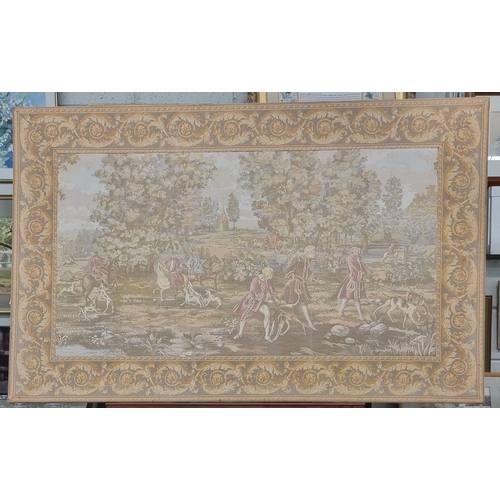 606 - A large French Tapestry of a hunting scene with floral border. 105 x 166 cm approx.