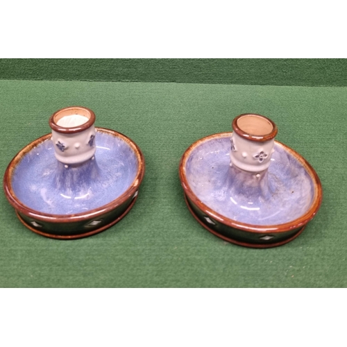 607 - A good quantity of Royal Doulton salt glaze Items to include two candlesticks and two pots.