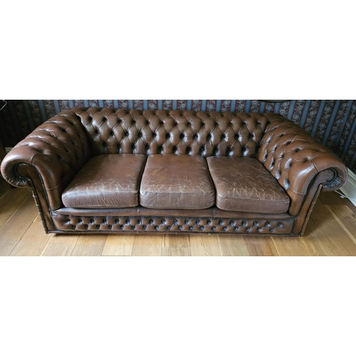 1037 - A good brown leather effect deep buttoned Chesterfield Settee. SH 43 x W 190 x D 90 cm approx.