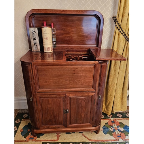 1061 - A good Hardwood lift up Drinks Cabinet with fall flap front. H 107 x W 91 x D 45 cm approx.