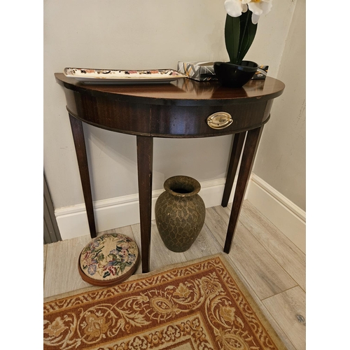 216 - An early 20th Century Mahogany half moon Table of neat proportions on square tapered supports.
84 x ... 