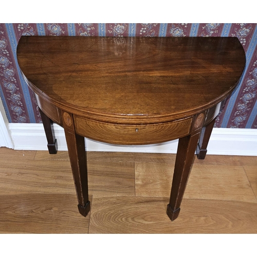 257 - A Regency Mahogany and inlaid half moon fold over Tea Table with square tapered supports and shell i... 