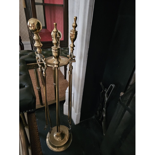 412 - A 19th Century Brass Companion Set on single shaft pedestal. H 80 cm approx.