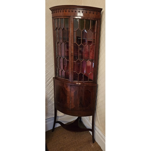 574 - A good Edwardian Mahogany Corner unit with twin glazed panel doors and solid base on square tapered ... 