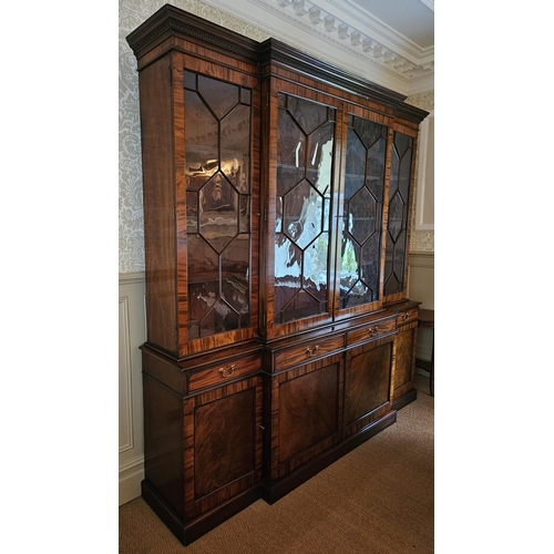 582 - A Magnificent Mahogany four door breakfront Bookcase with frieze drawer moulded centre glazed panel ... 