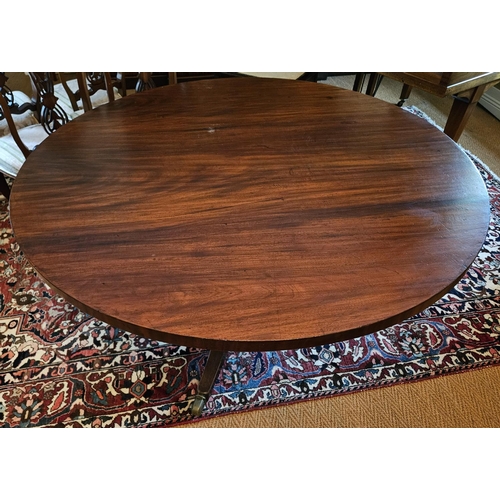 623 - A Regency Mahogany circular Supper Table of neat form on tripod support. D 133 x H 72 cm approx.