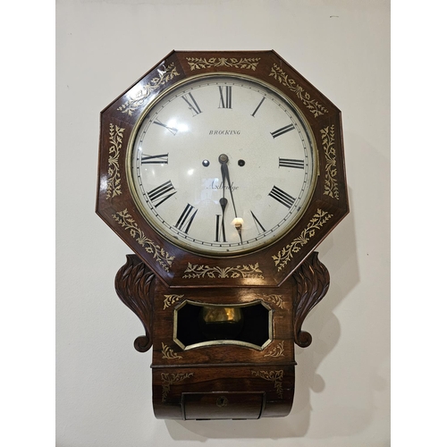 716 - A Regency Rosewood and Brass inlaid wall mounted Clock with a white enamel dial by Brocking of Axbri... 