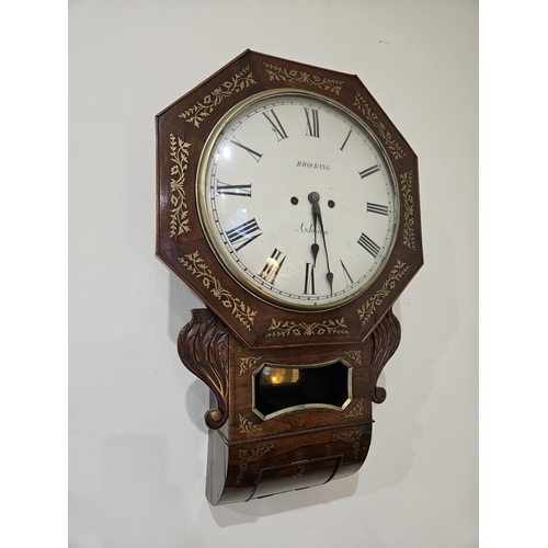 716 - A Regency Rosewood and Brass inlaid wall mounted Clock with a white enamel dial by Brocking of Axbri... 