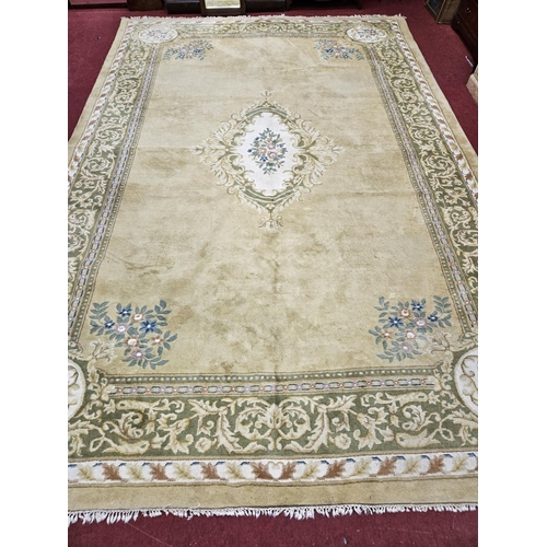 495 - Of Superb quality. A extremely large large cream ground Carpet with a large central medallion design... 