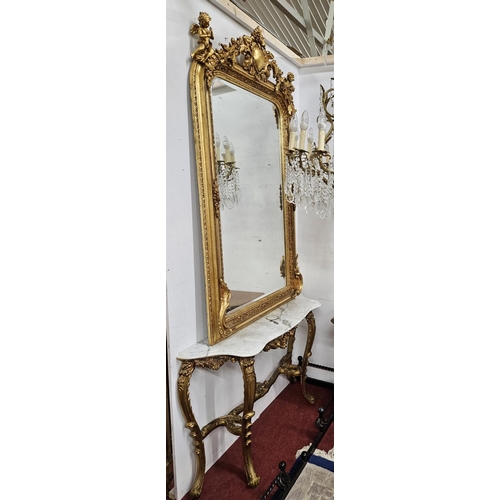 603 - A good 20th Century Timber and Plaster Gilt Overmantel Mirror with bevelled mirror glass and cartouc... 