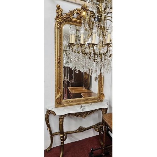 603 - A good 20th Century Timber and Plaster Gilt Overmantel Mirror with bevelled mirror glass and cartouc... 