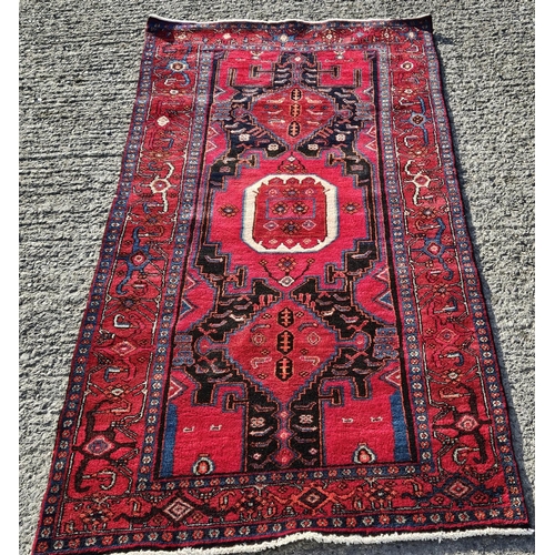 1008 - A burgundy ground Rug, 245 x 126 cm approx.