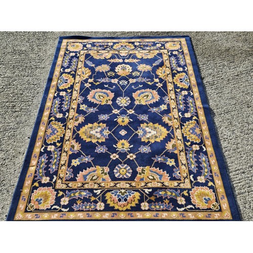 1027 - A  rich blue ground full pile Turkish Carpet with an all over gold floral pattern design295 x 195 cm... 