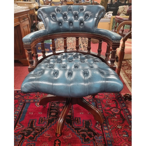 1000 - A good reproduction swivel Chair with blue deep buttoned leather upholstery. W 62 x SH 49 x BH 86 cm... 