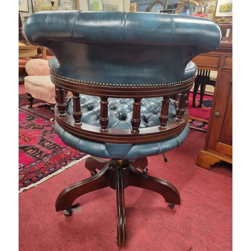 1000 - A good reproduction swivel Chair with blue deep buttoned leather upholstery. W 62 x SH 49 x BH 86 cm... 