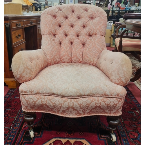 1006 - A good 19th Century Easy Armchair with salmon colour damask fabric, deep buttoned back and turned su... 