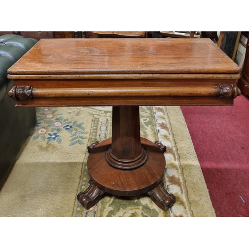 502 - A 19th Century Mahogany fold over Tea Table on octagonal support and platform base with unusual carv... 