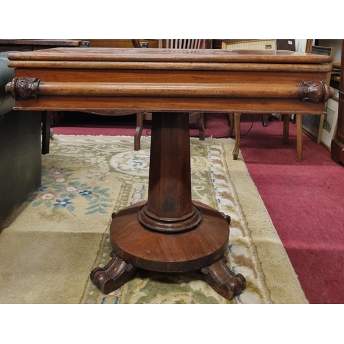 502 - A 19th Century Mahogany fold over Tea Table on octagonal support and platform base with unusual carv... 