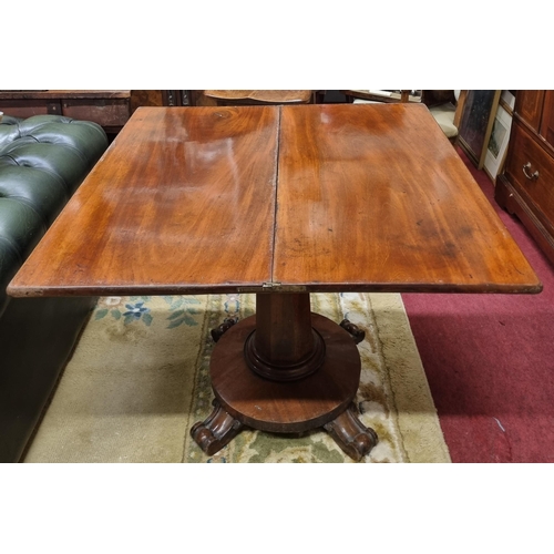 502 - A 19th Century Mahogany fold over Tea Table on octagonal support and platform base with unusual carv... 