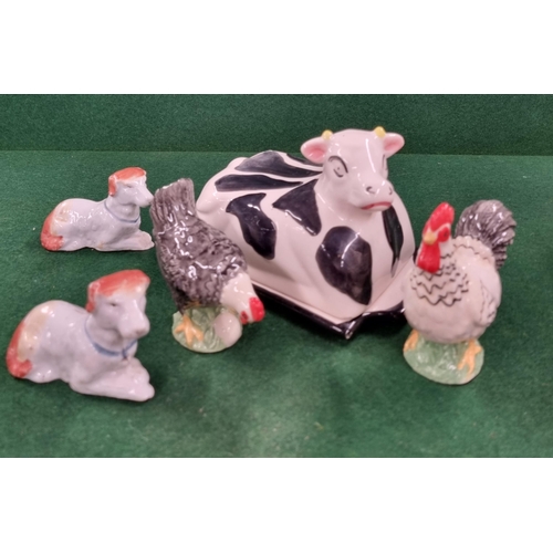 668 - A quantity of animal figures to include a cock and hen Condiment.