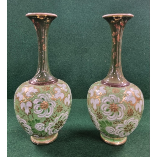 674 - A pair of 19th Century Royal Doulton salt glaze bud Vases with green ground. H 25 cm approx.