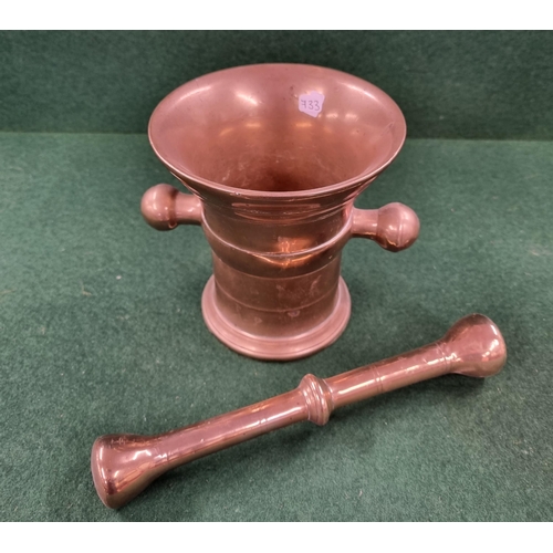 687 - A really heavy Brass Mortar and Pestle. H 13 cm approx.