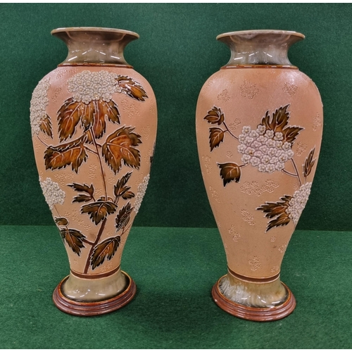 695 - A good pair of 19th Century Royal Doulton salt glaze Vases of bulbous form with flower and leaf deco... 