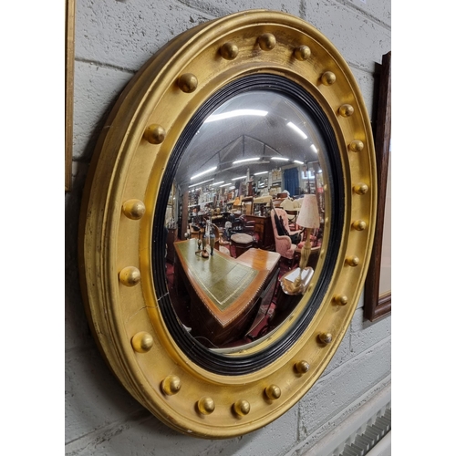 719 - A good early 19th Century Timber and Plaster gilt circular convex Mirror with classical ball design ... 