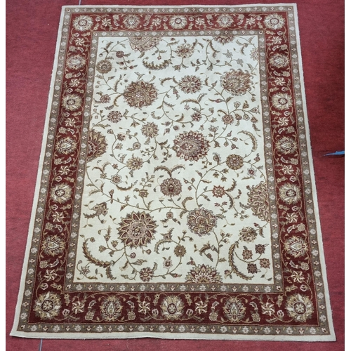 743 - A cream and burgundy ground Carpet with multi borders and unique medallion design. 170 x 226 cm appr... 