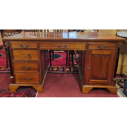 998 - A good reproduction Mahogany partners Desk with triple freeze drawer. W 150 x 74 x H 78 cm approx.