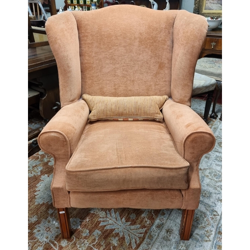 1162 - A good pair of salmon coloured wing back Chairs of large size. SH 50 x W 80 x D 77 cm approx.