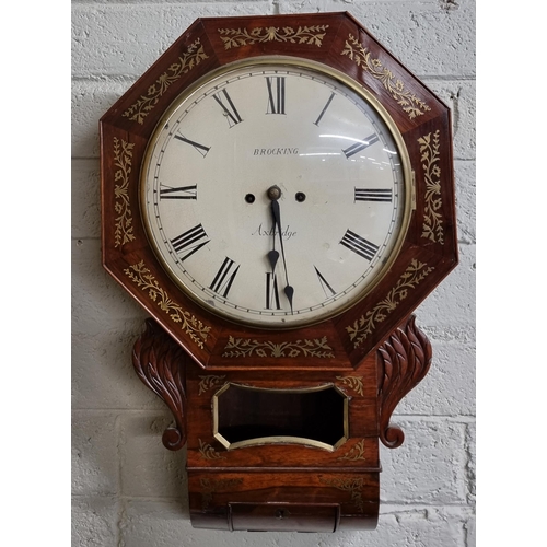 716 - A Regency Rosewood and Brass inlaid wall mounted Clock with a white enamel dial by Brocking of Axbri... 