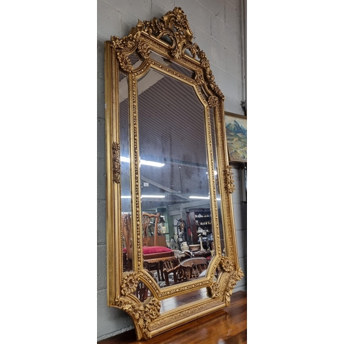 901 - An extremely large Timber and Plaster Gilt Overmantel Mirror with highly pierced cartouche top and s... 