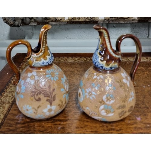 973 - A pair of 19th Century Royal Doulton salt glaze Ewers along with a pair of 19th Century Royal Doulto... 