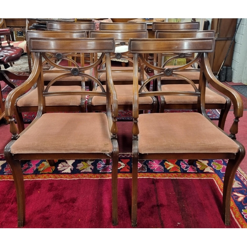 1007 - A good set of eight 20th Century Mahogany dining Chairs with sabre front legs and x-frame pierced ba... 