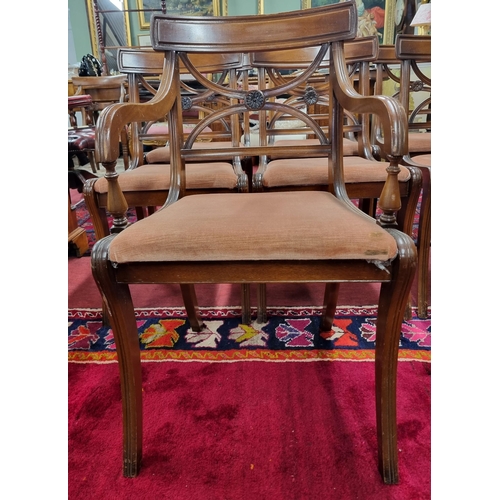 1007 - A good set of eight 20th Century Mahogany dining Chairs with sabre front legs and x-frame pierced ba... 