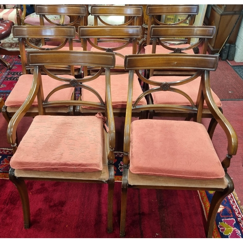 1007 - A good set of eight 20th Century Mahogany dining Chairs with sabre front legs and x-frame pierced ba... 