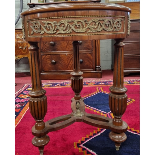 1052 - A really good 20th Century Rosewood and veneered circular Side Table with ormolu mounts on turned fl... 