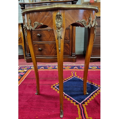 783 - A Continental Rosewood and Veneered Side Table with serpentine outline and ormolu mounts on cabriole... 